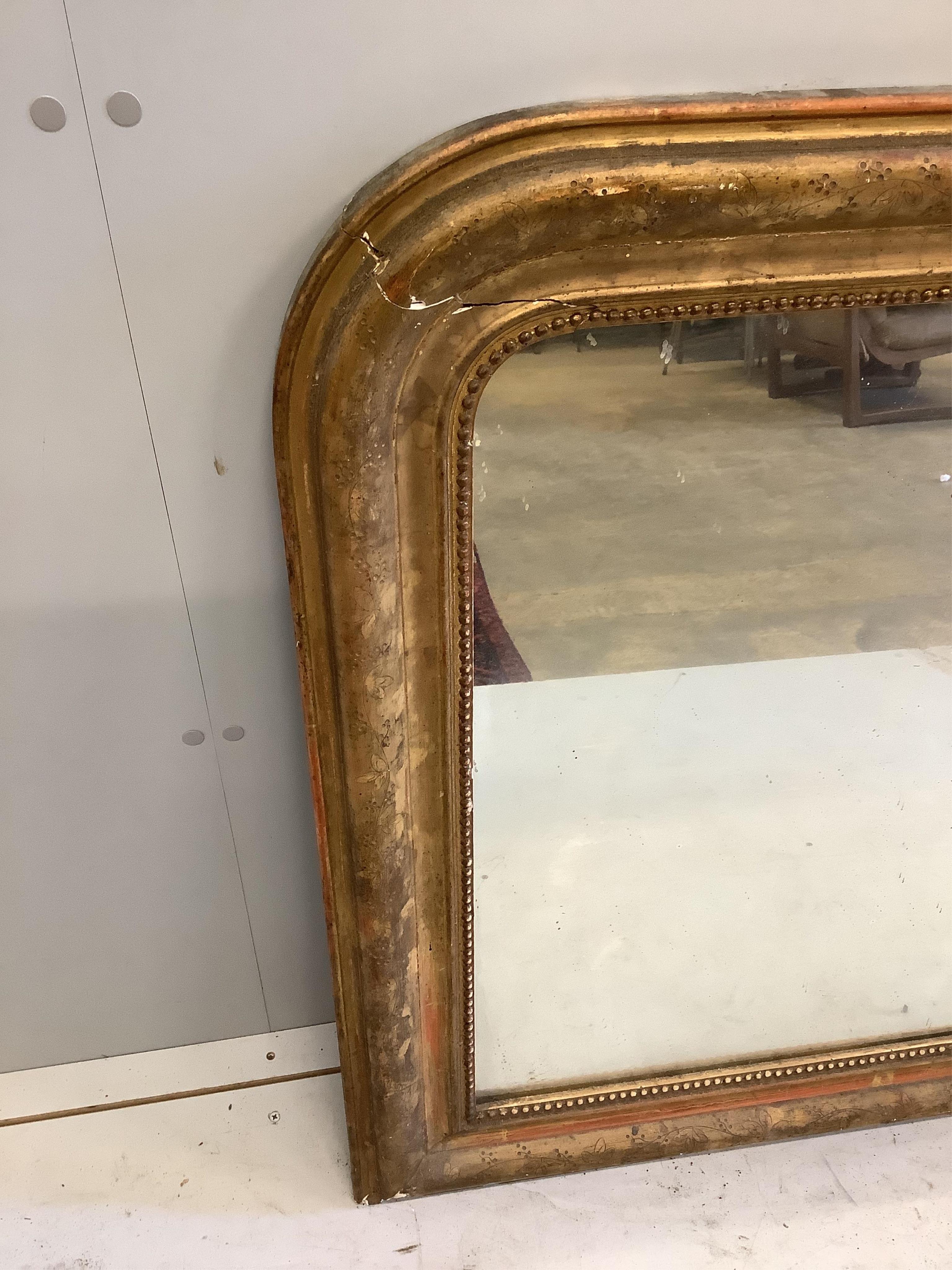 A late 19th century French giltwood and gesso overmantel mirror, width 144cm, height 90cm. Condition - poor, losses around frame and cracking